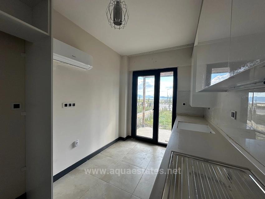 2+1-Zimmer-Wohnung In Köyceğiz Zu Vermieten, Erdgeschoss, Alle Zimmer Klimatisiert, In Einer Wohnanlage Mit Zugangskontrolle.