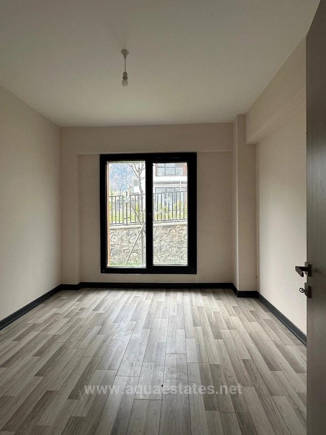 3+1-Zimmer-Wohnung In Köyceğiz Zu Vermieten, Erdgeschoss, Alle Zimmer Klimatisiert, In Einer Wohnanlage Mit Zugangskontrolle.